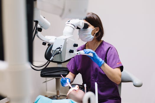 What is Dental Practice Funding? Female dentist using a microscope and modern technology during a patient examination in a dental clinic. What is Dental Practice Funding? Female dentist using a microscope and modern technology during a patient examination in a dental clinic.